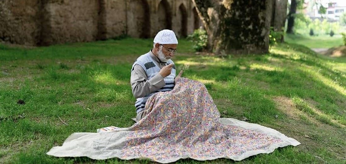 An artisan with a Pashmina shawl